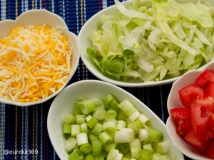 shredded lettuce, diced tomatoes, green onions and shredded cheese